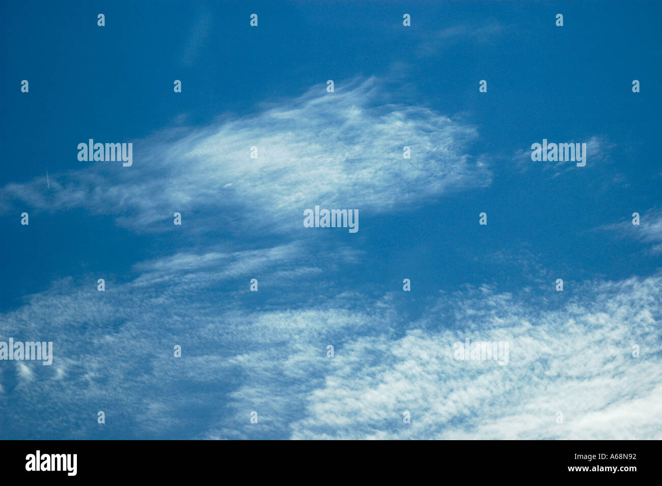 Thin wispy cirrus clouds in a brilliant blue sky Stock Photo - Alamy