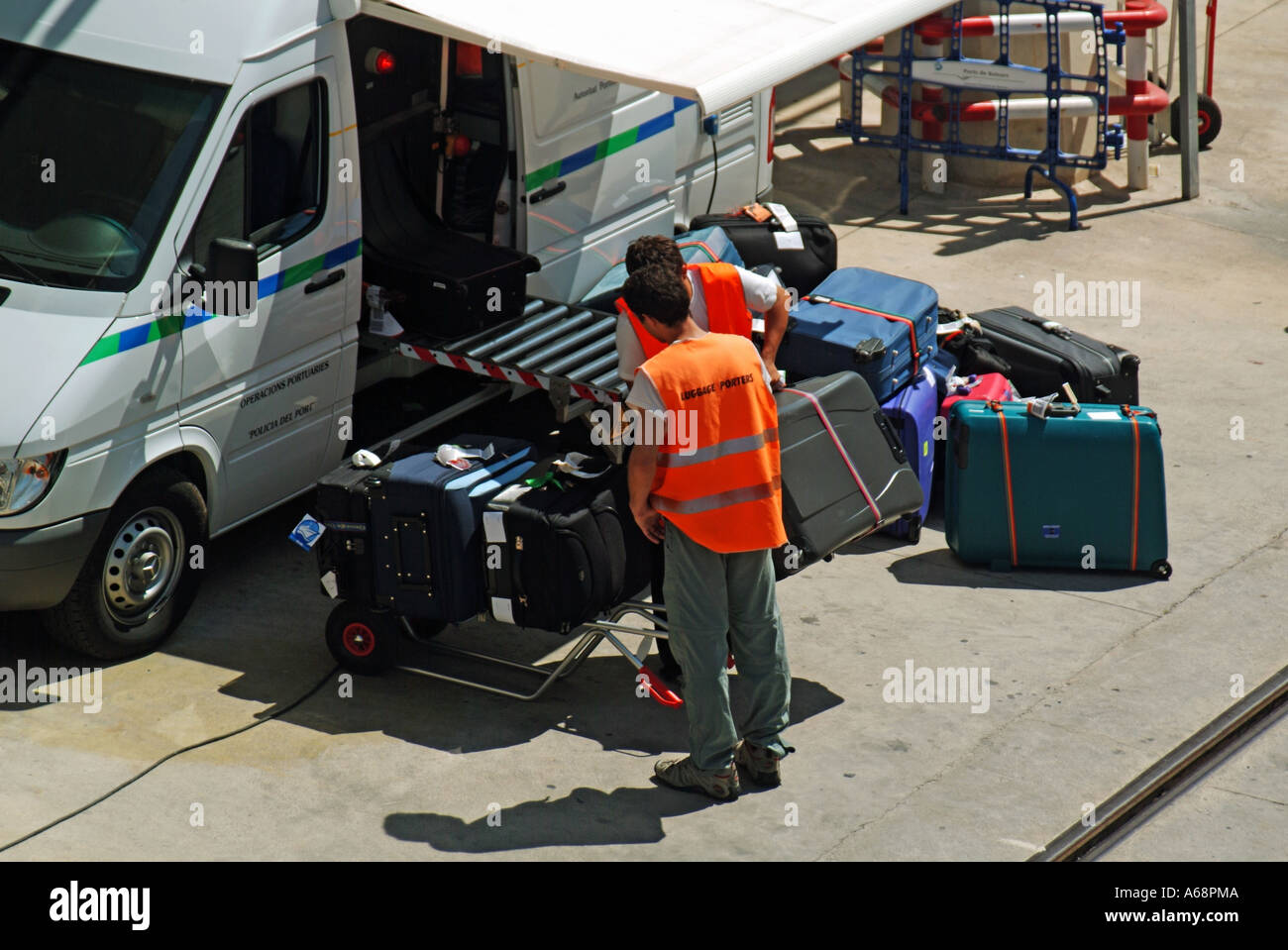 Cruise ship holiday passengers luggage passing through van based mobile Xray scanning device before being allowed onboard Palma Majorca Port Spain EU Stock Photo