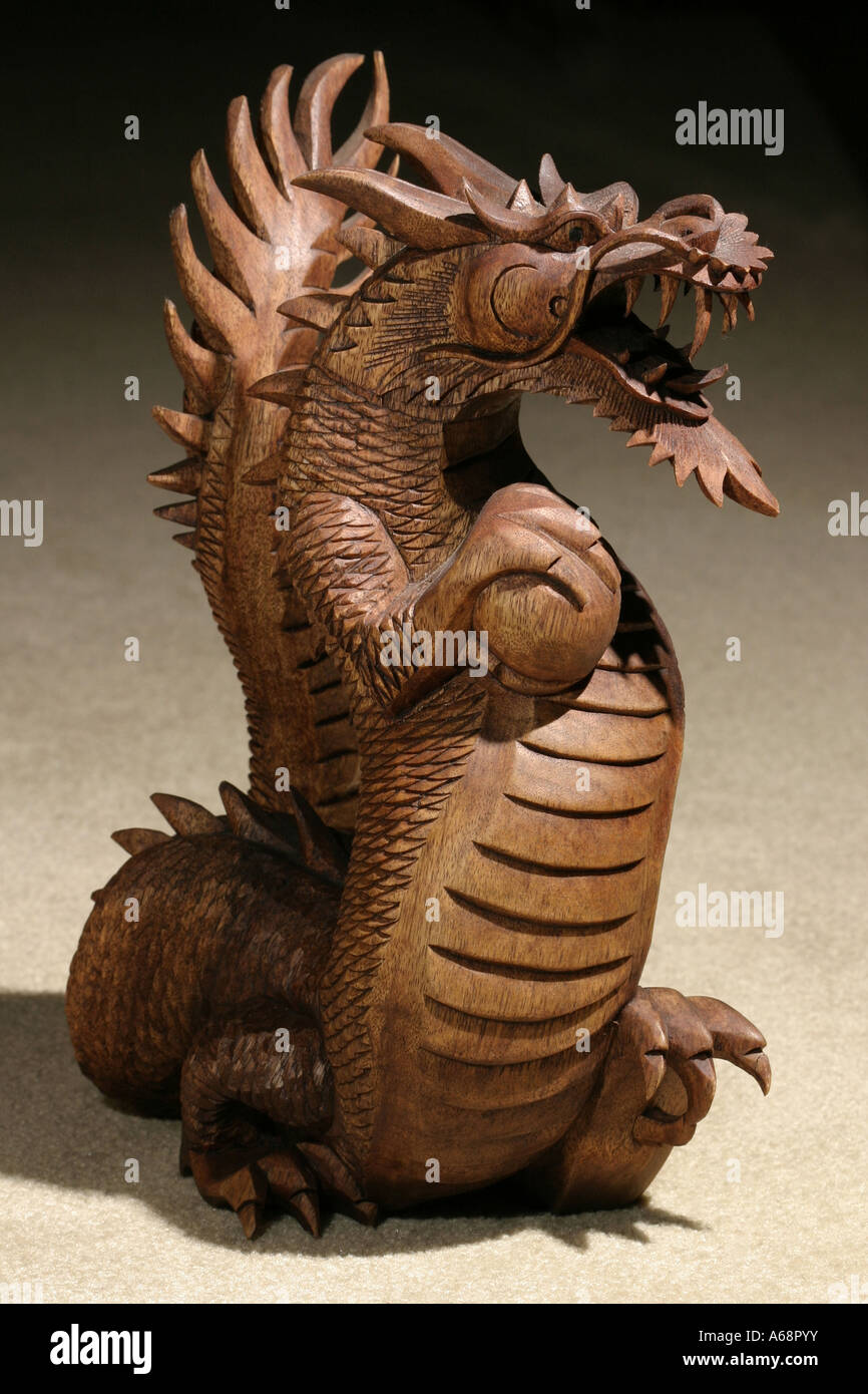 A carved wooden Chinese Dragon Statue Stock Photo