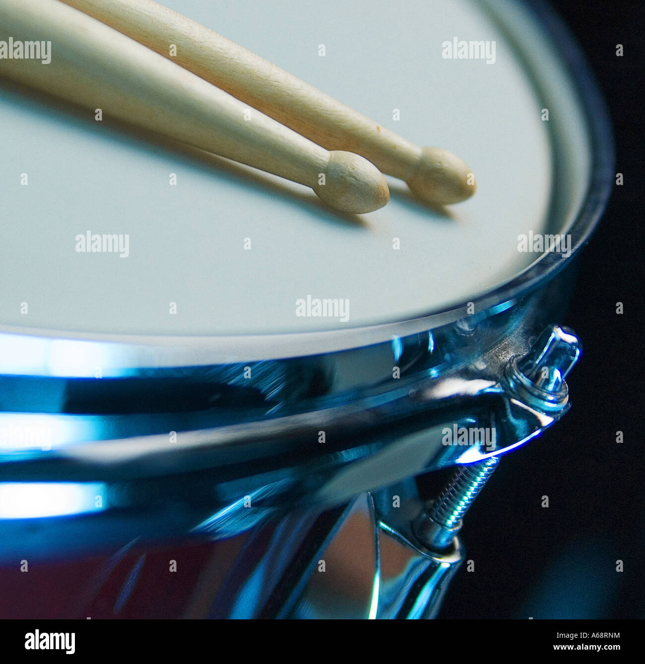 close up of new drum sticks on a snare drum with new skin Stock Photo