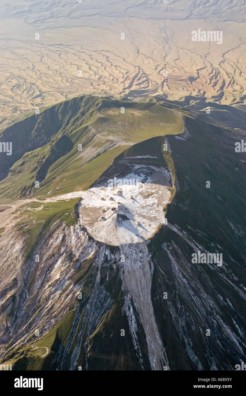 Ol Doinyo Lengai, panoramic aerial view of the cone and old lava flow (white) from the crater Tanzania Stock Photo