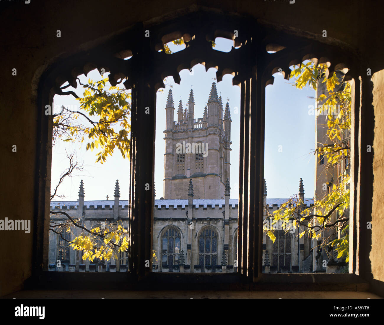 View through arches of cloisters to tower of Magdalen College , Oxford , England. Stock Photo