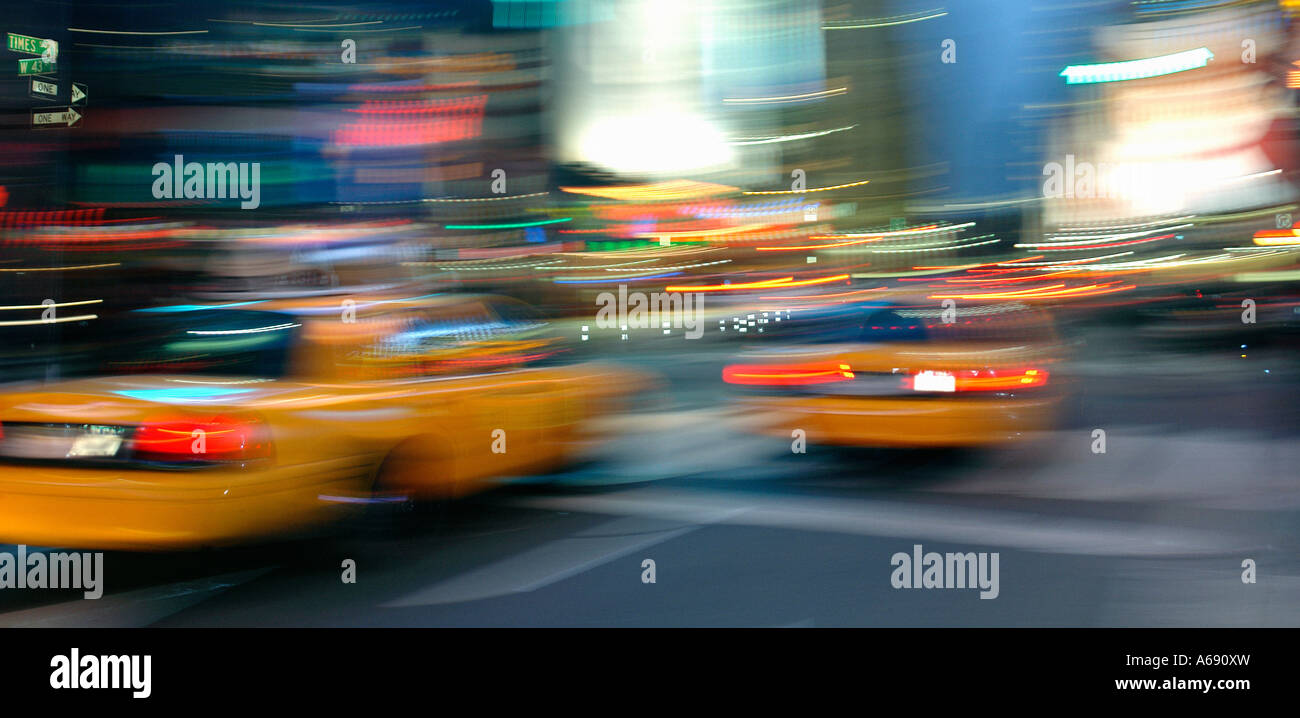 Blurred Motion Urban Scene of Yellow Cabs Taxis in Times Square New York City NYC USA Stock Photo