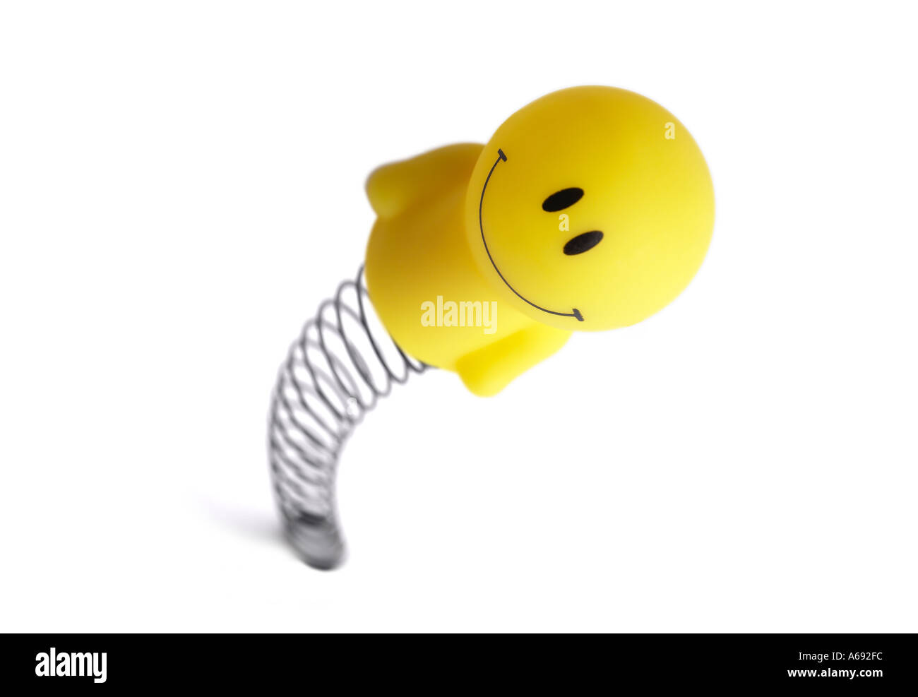 happy wind up toy on spring Stock Photo