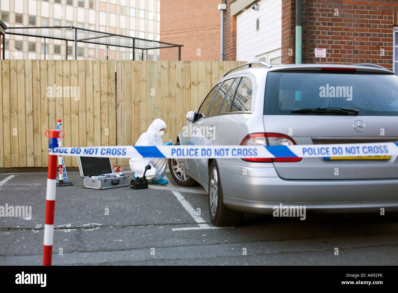 Crime Scenes Officer collecting evidence from car tyre Stock Photo Alamy