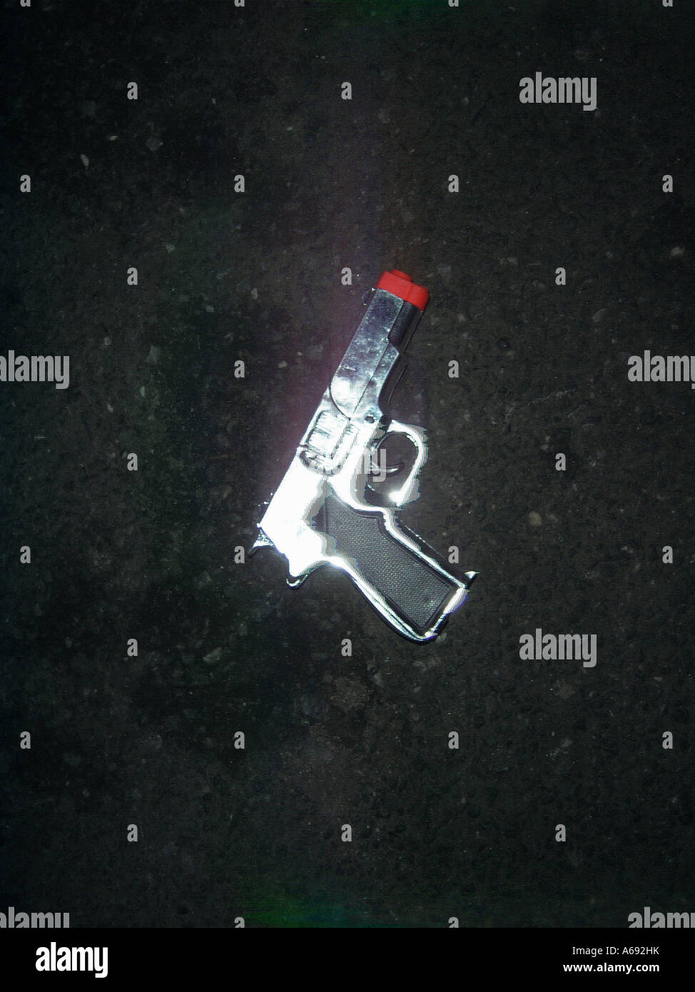 Still Life of Toy Gun in the Street Copy Space Stock Photo