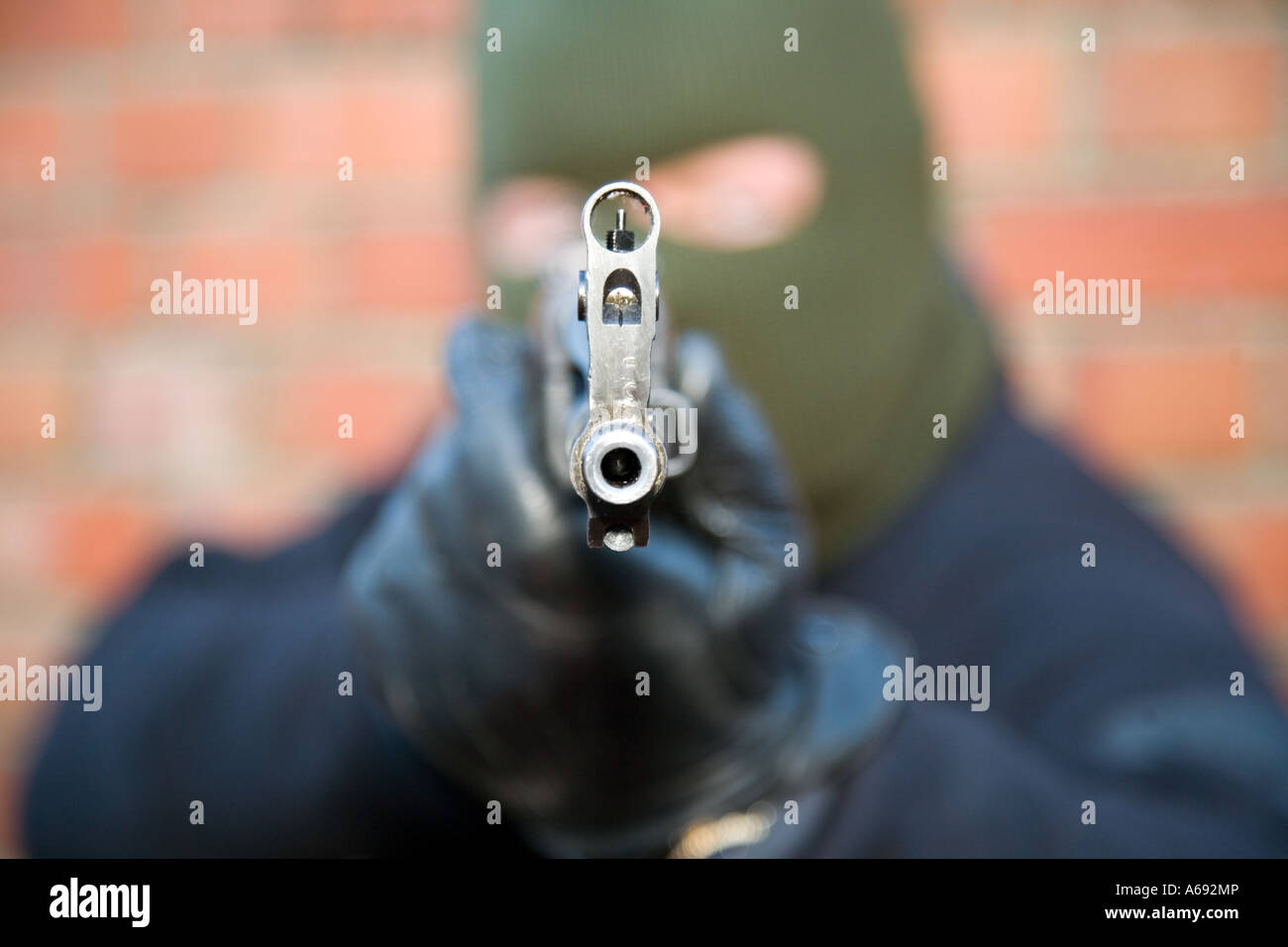 Masked arm robber  / terrorist with Chinese AK47 assault rifle Stock Photo