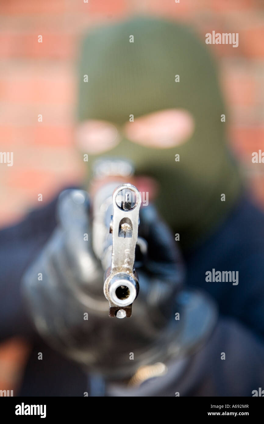Masked arm robber  / terrorist with Chinese AK47 assault rifle Stock Photo