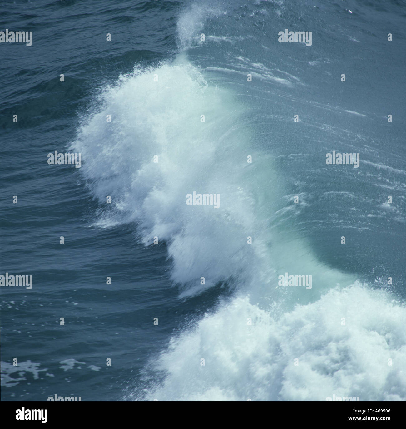 large wave pounds Hawaiian shore line Stock Photo