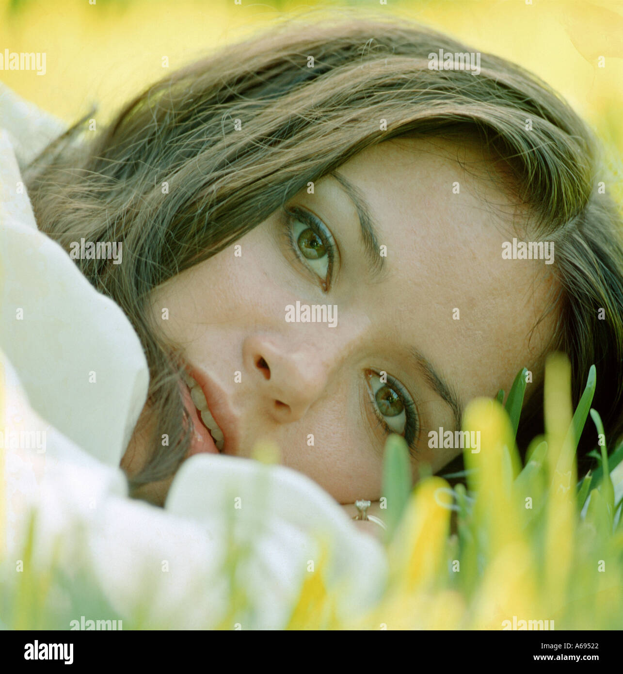 Pretty girl lying on grass hi-res stock photography and images - Alamy