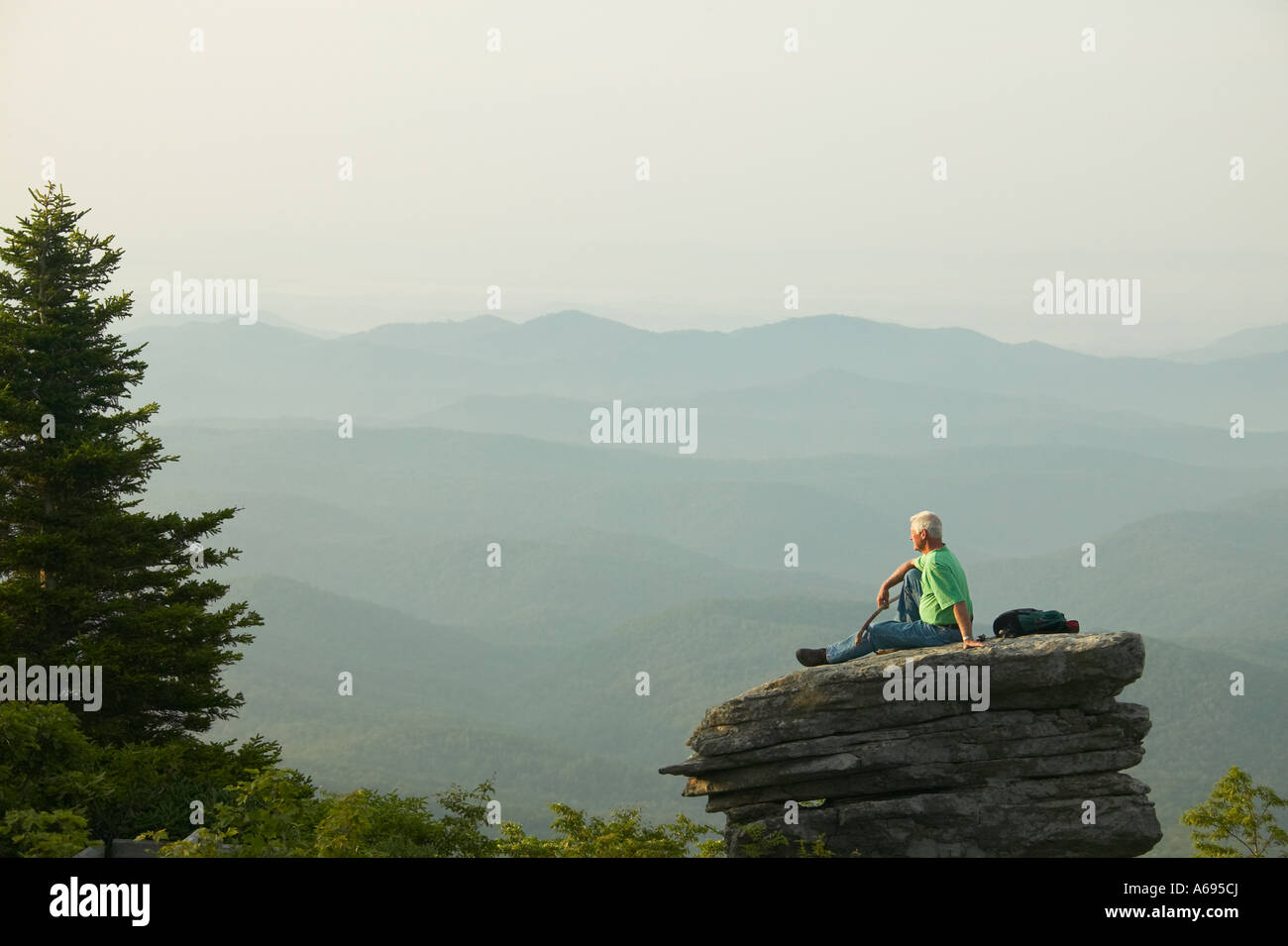 mature man sitting on rock in Blue Ridge Mountains North Carolina Stock ...