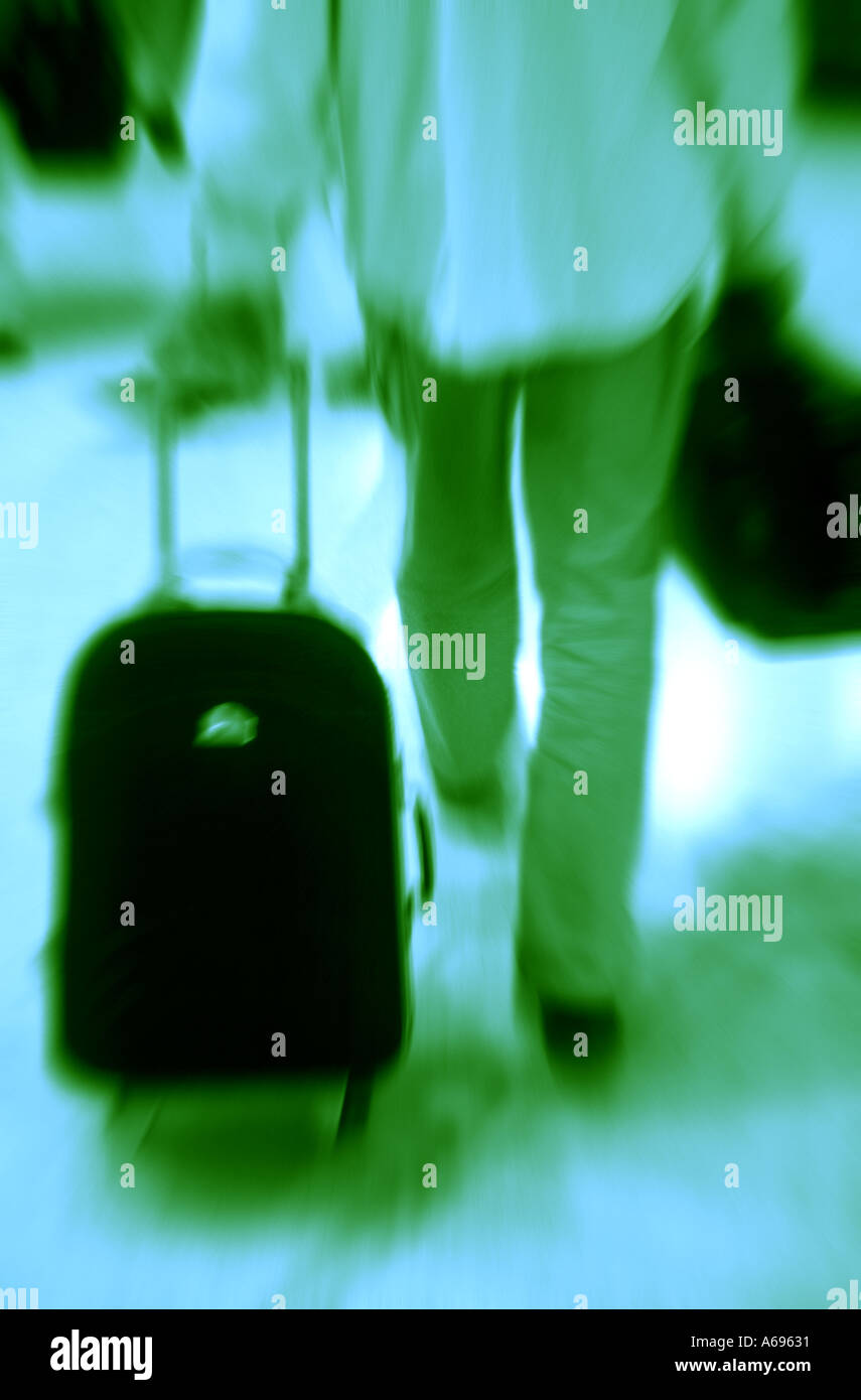 Passenger pulling cabin luggage Stock Photo Alamy