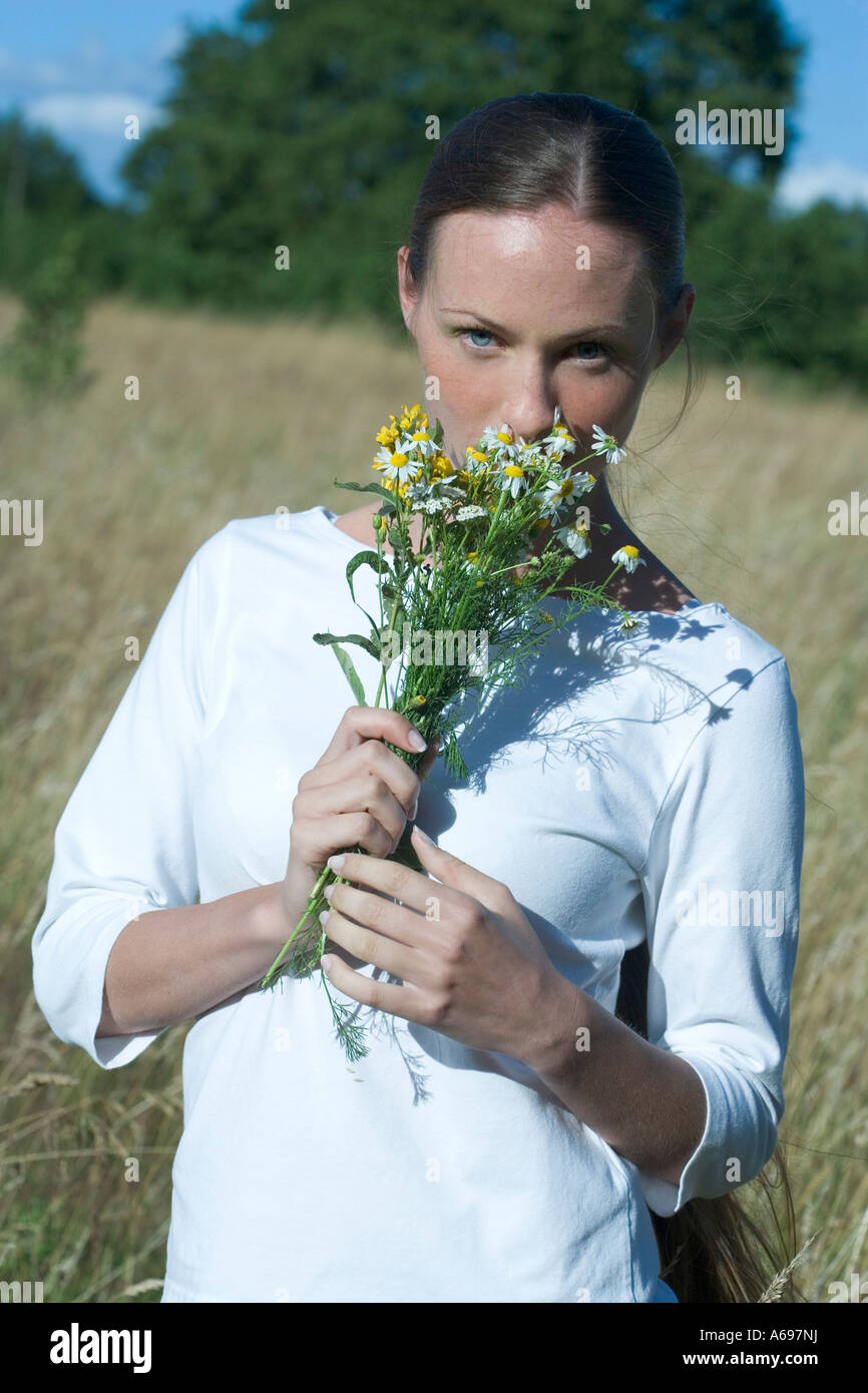 young woman walking on field Stock Photo - Alamy