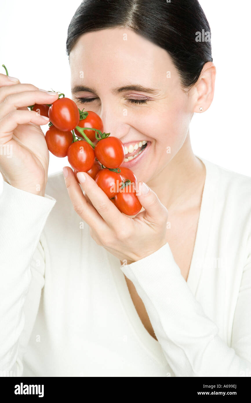 woman holding tomatoes Stock Photo - Alamy
