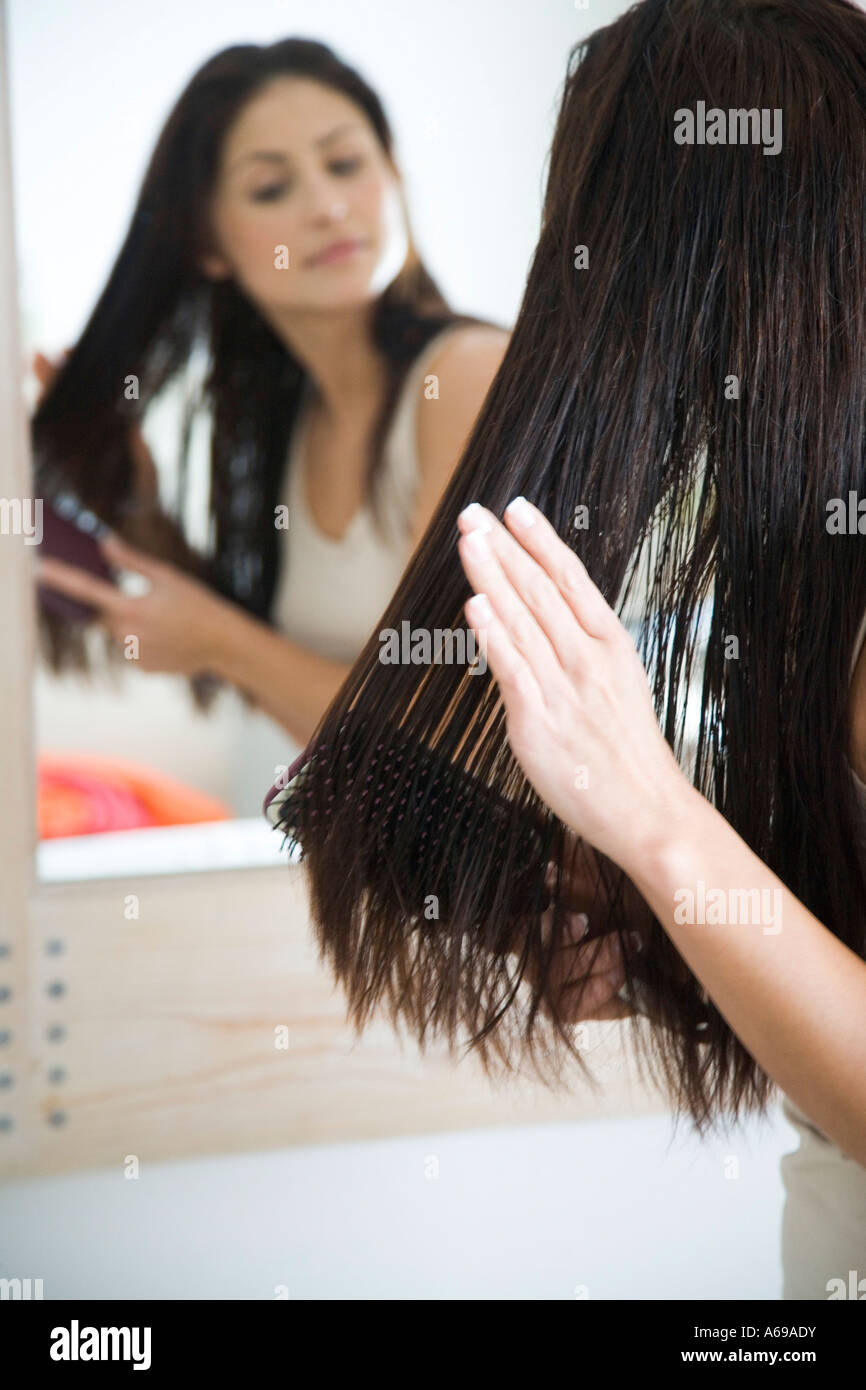 woman combing hair Stock Photo - Alamy