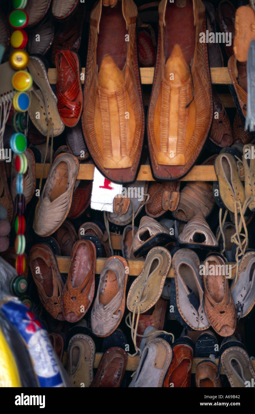 Giant sized shoes used as part of a shoemakers market stall display