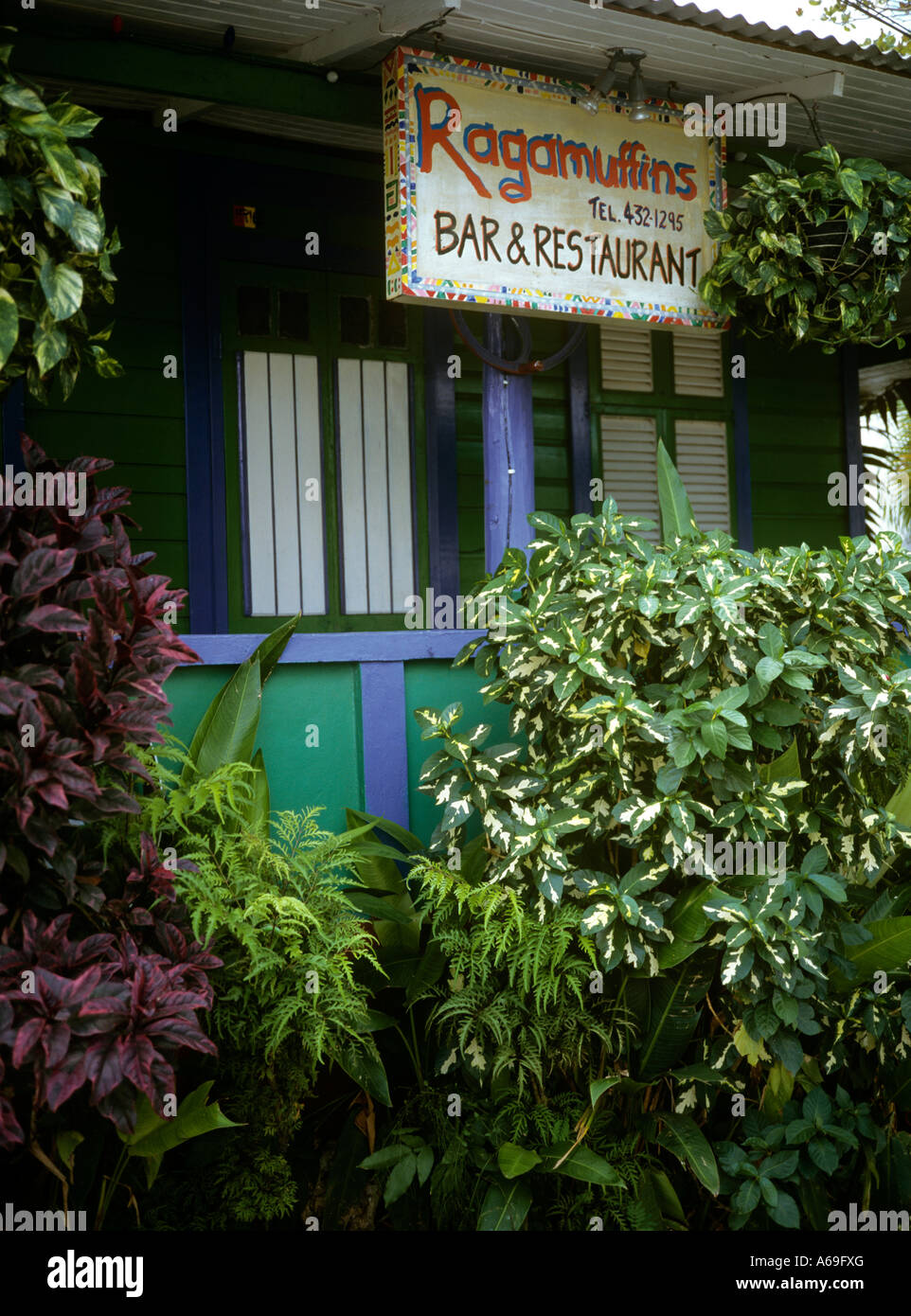 Barbados Holetown Ragamuffins bar front set in tropical garden Stock