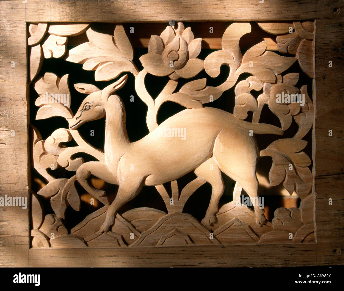 Bhutan Bumthang Valley Jakar crafts Woodcarving deer panel in blue pine Stock Photo
