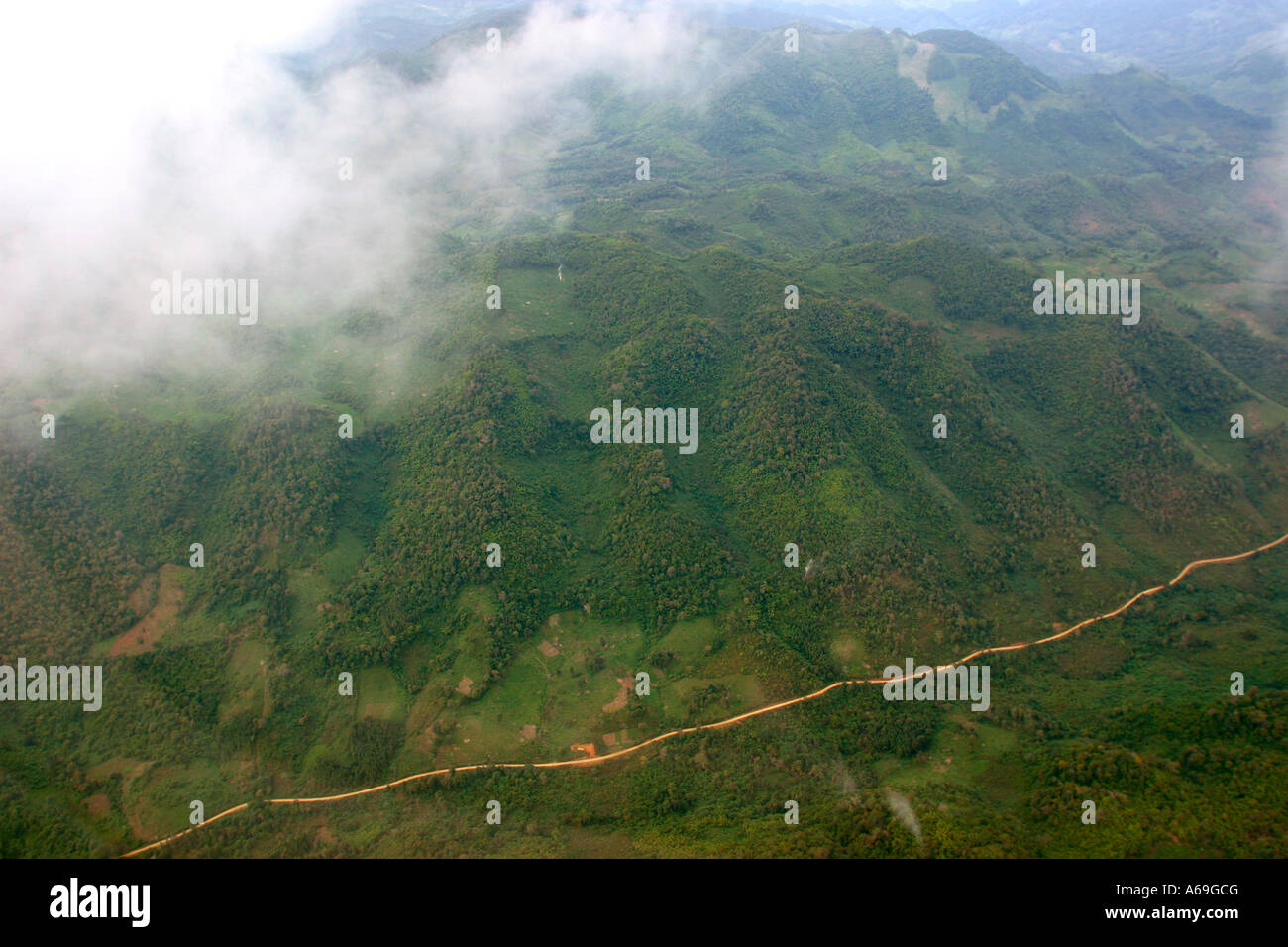 Laos aerial wooded Hills and dirt road near Luang Prabang Stock Photo