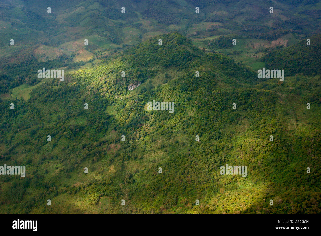 Laos aerial wooded hills near Luang Prabang showing deforested clearings Stock Photo