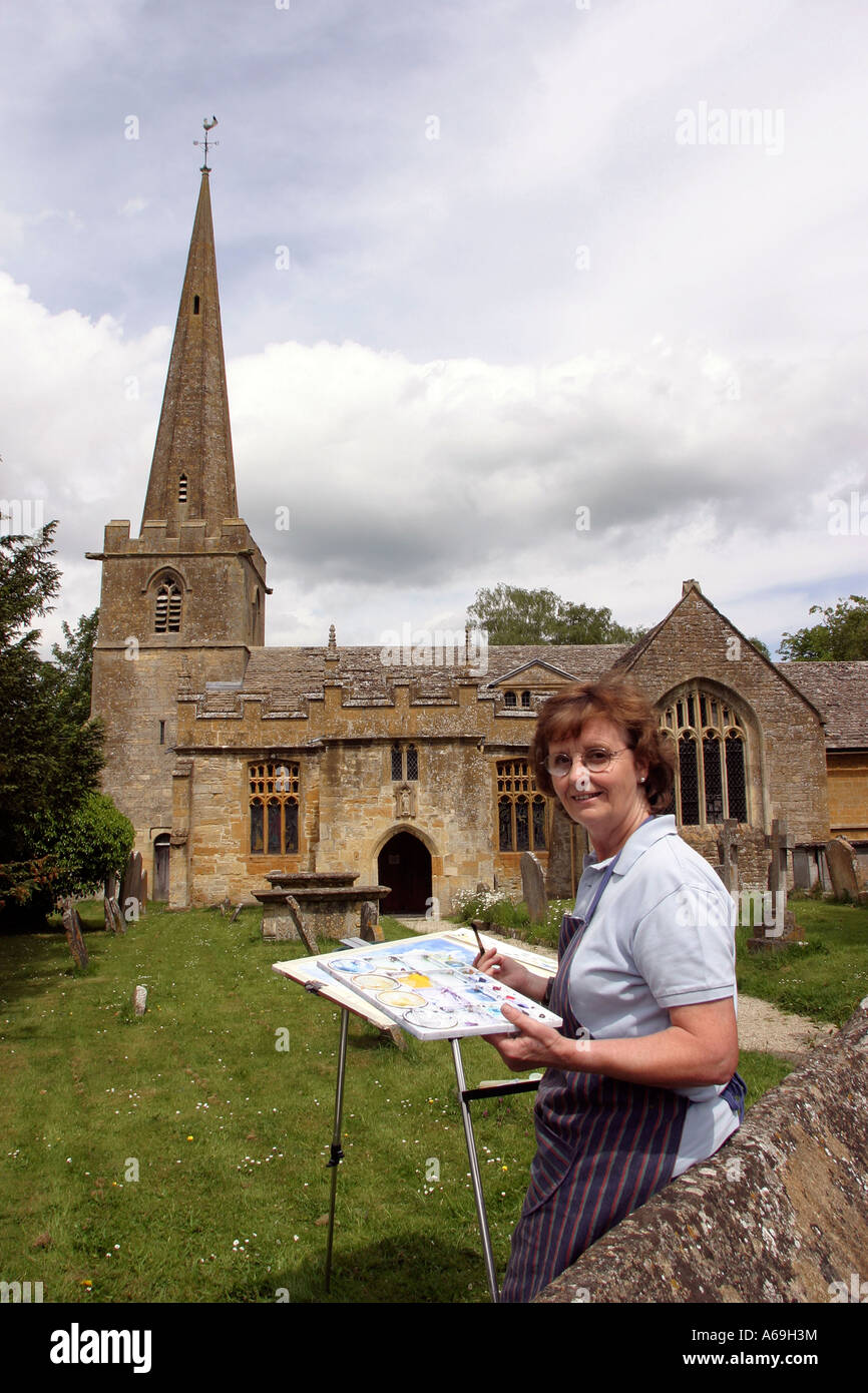 UK Worcestershire Stanton Church amateur artist Anne Blane painting in churchyard Stock Photo