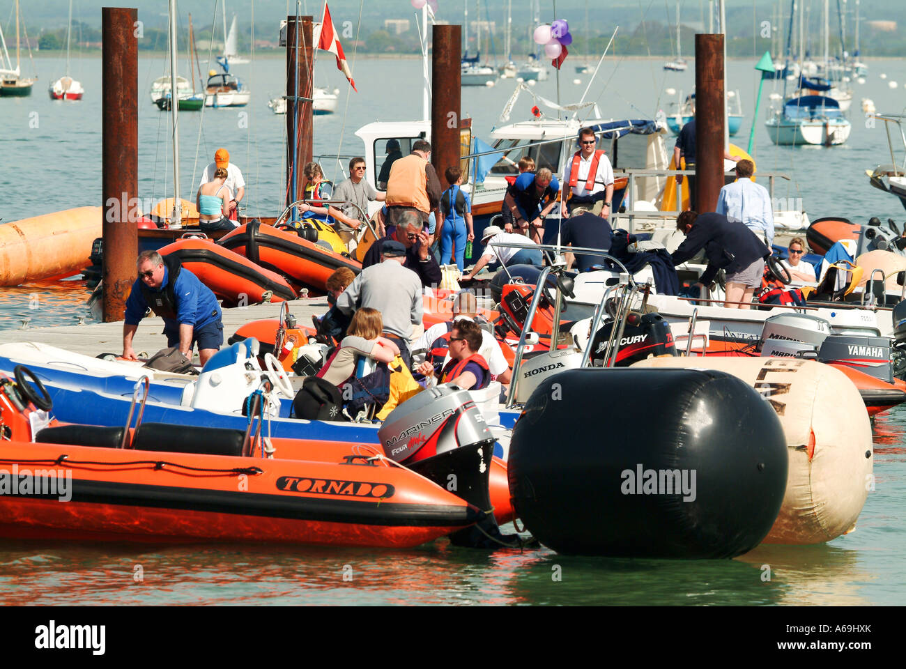 Rescue boats moored at jetty Stock Photo - Alamy