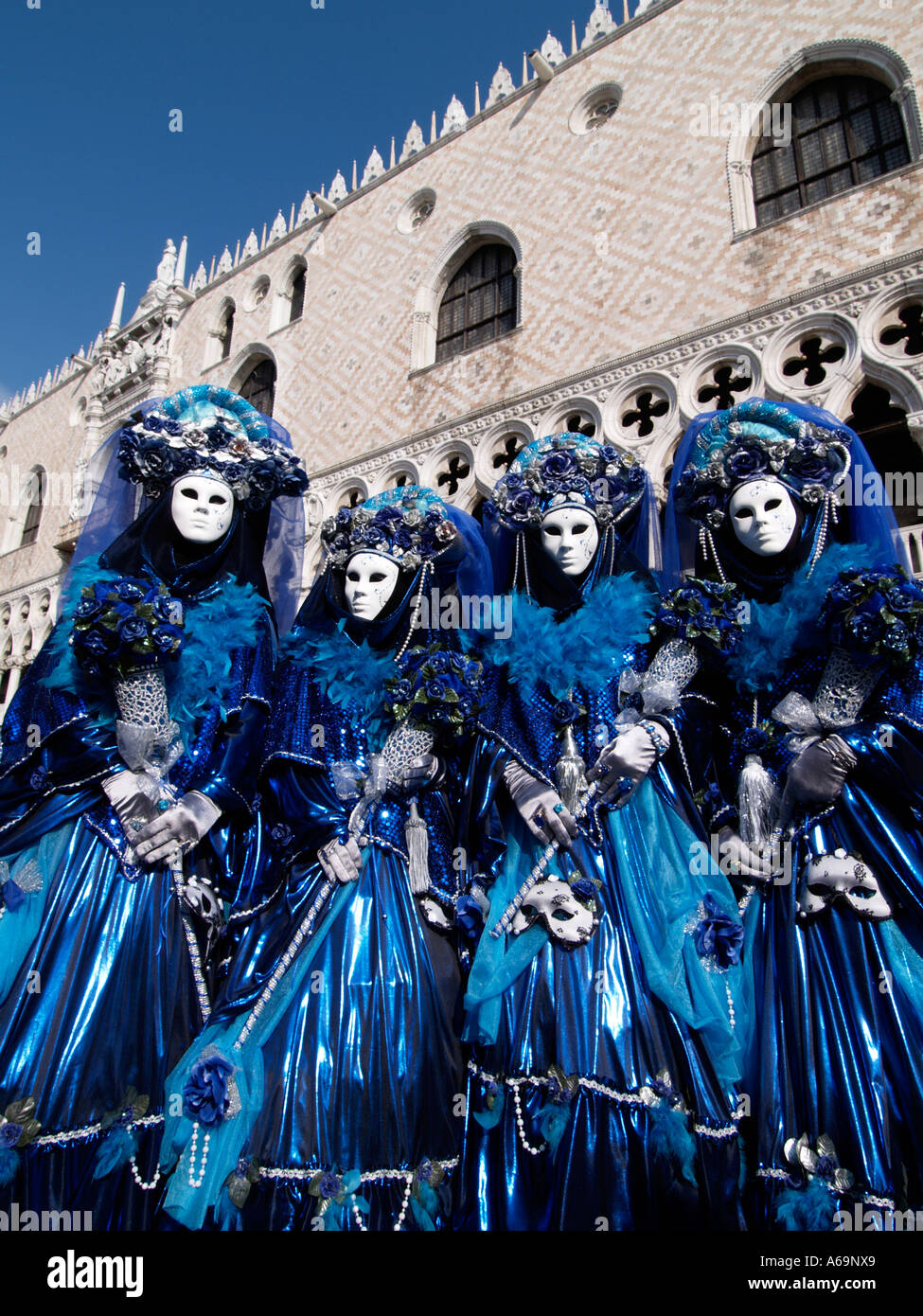 four people wearing blue costumes Venice carnival 2006 Stock Photo