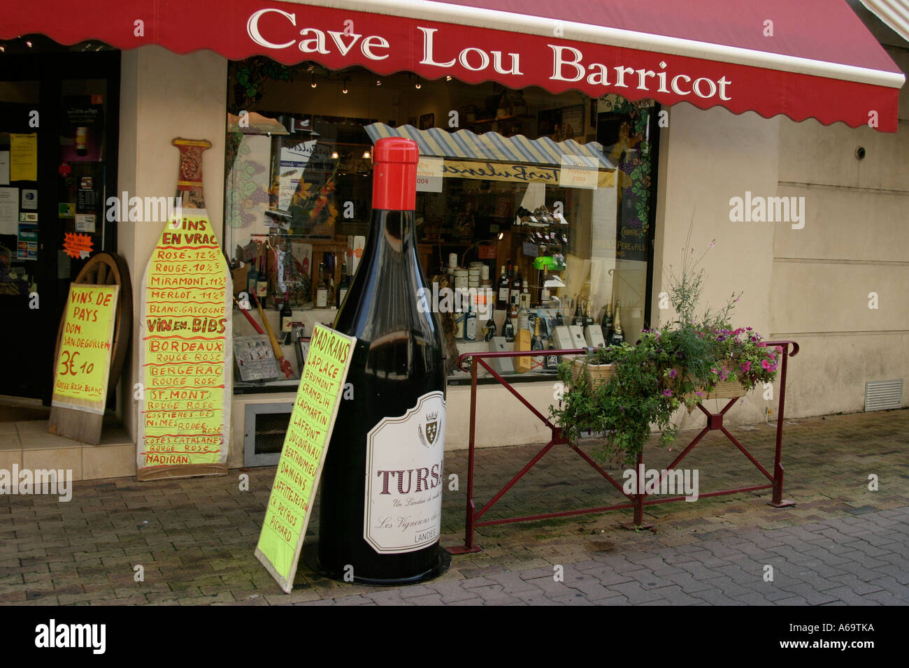 Giant bottle of red wine outside a wine shop Aire sur l'Adour France