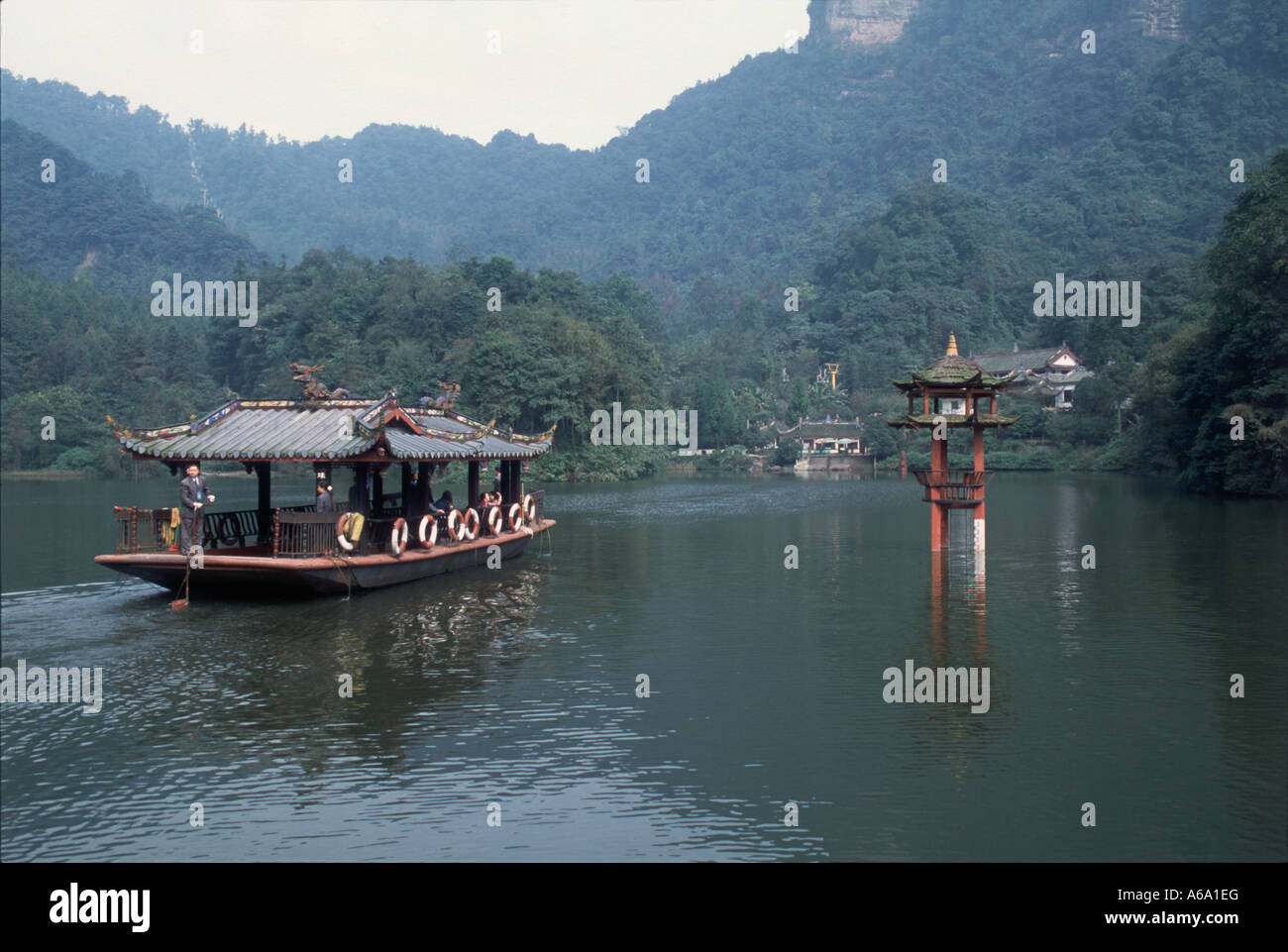 China, Sichuan, Qingcheng Shan, ferry on scenic Yuechang Hu (Moon Wall Lake)  at renowned Daoist retreat, lush forested hills Stock Photo - Alamy