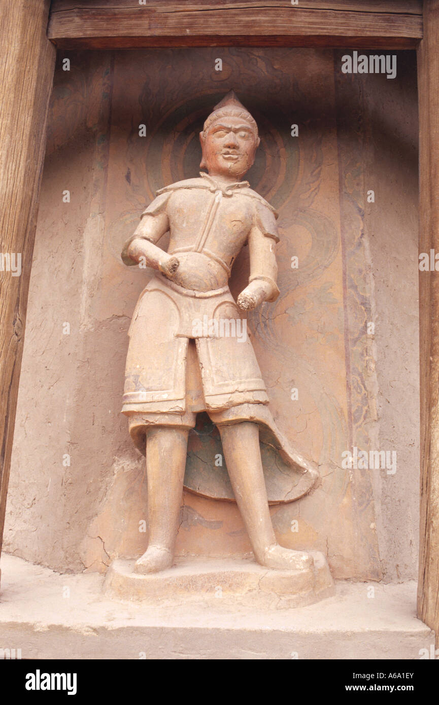 China, Gansu, Mogao Caves, Cishi Pavilion, carved stonework niche statue Stock Photo