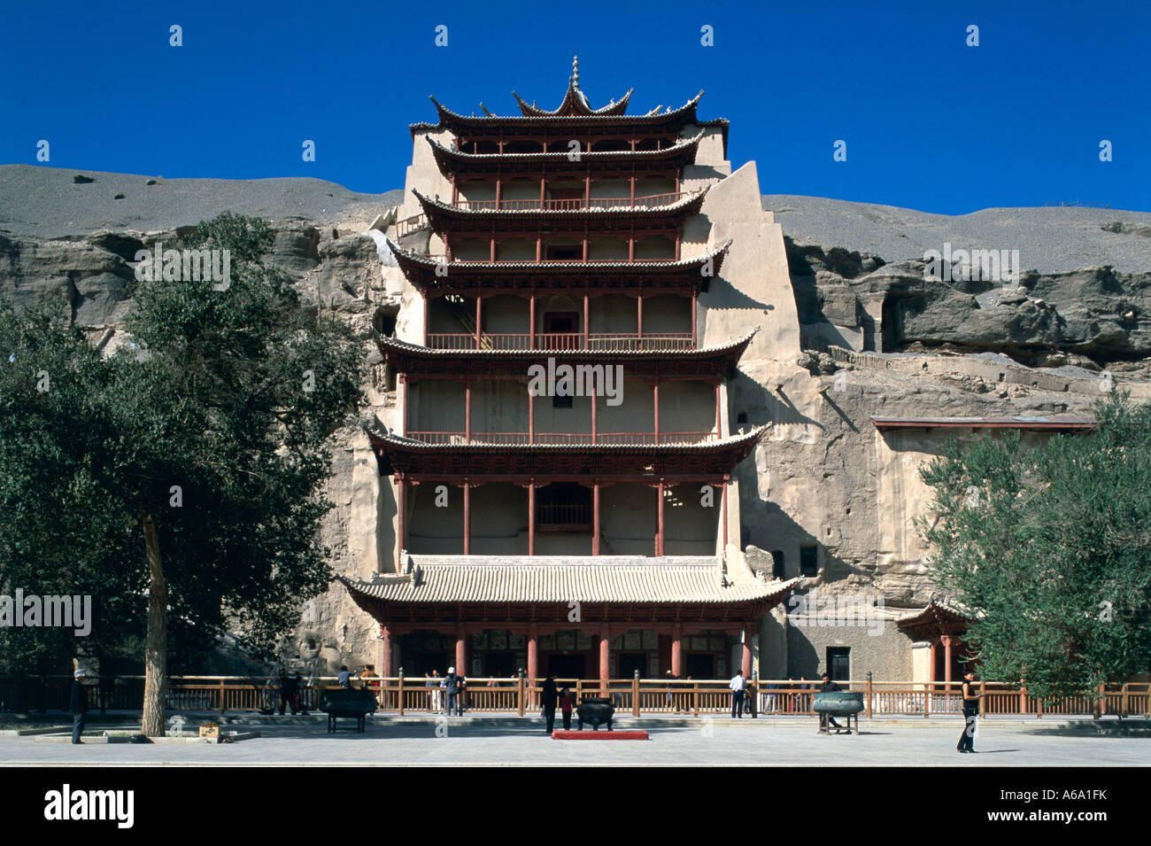 China, Gansu, Mogao Caves, Cave 96, pagoda-fronted cliff face covering 30-meter statue of Buddha Stock Photo