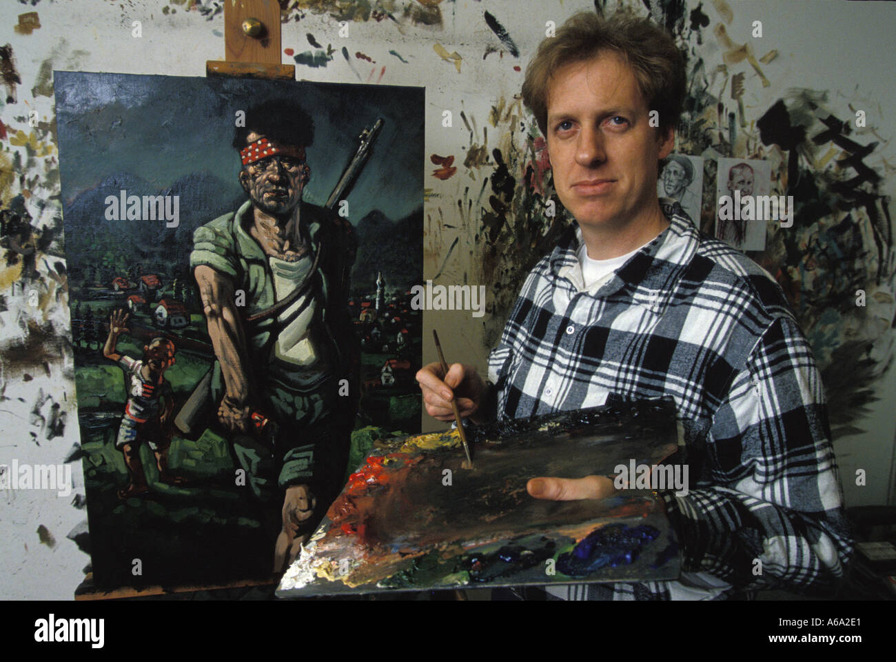 Painter Peter Howson with work from Bosnia Stock Photo