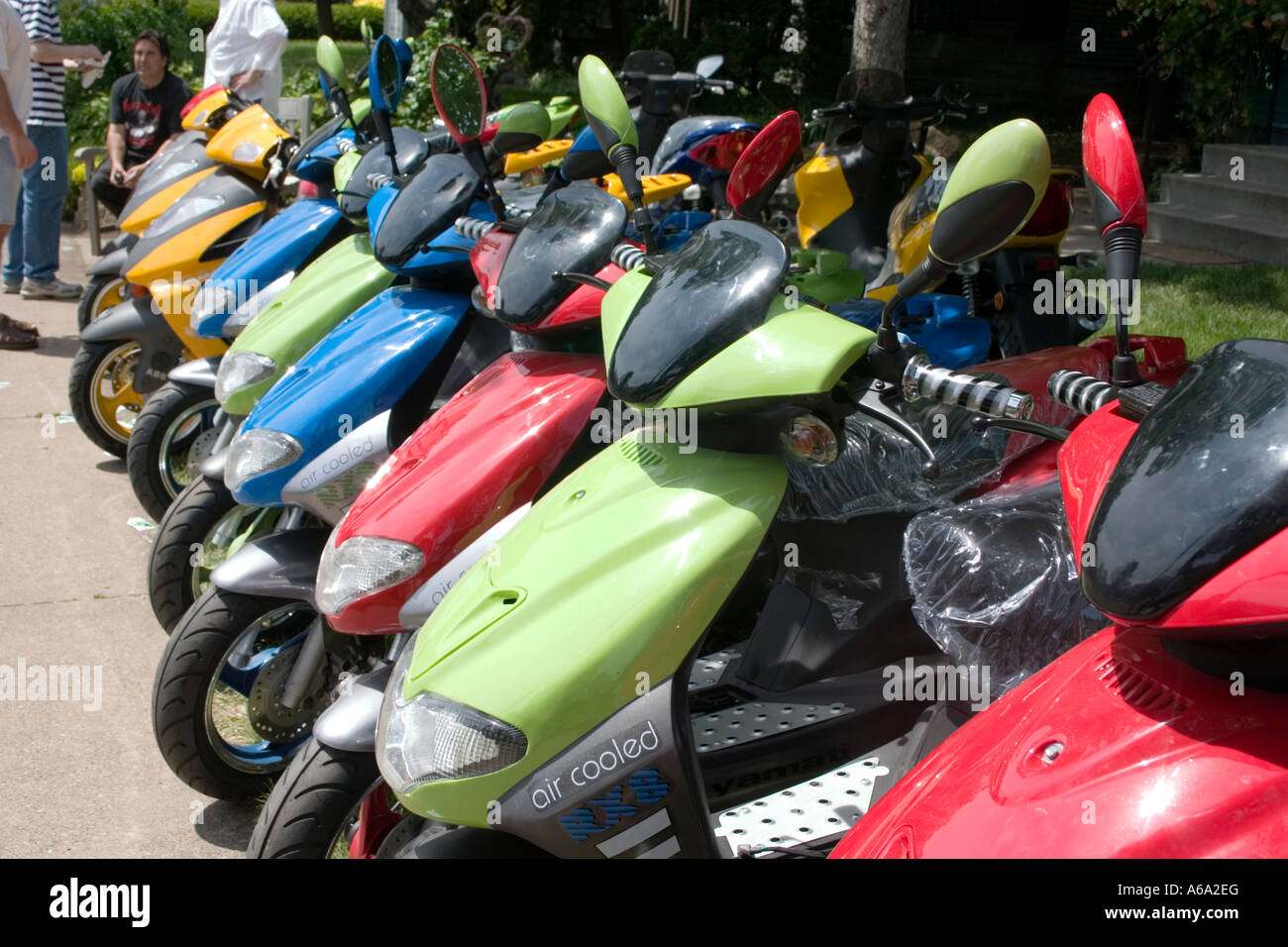 A colorful lineup of Strada RX8 Two Stroke 49.5cc air-cooled Scooters. Grand Old Day St Paul Minnesota USA Stock Photo
