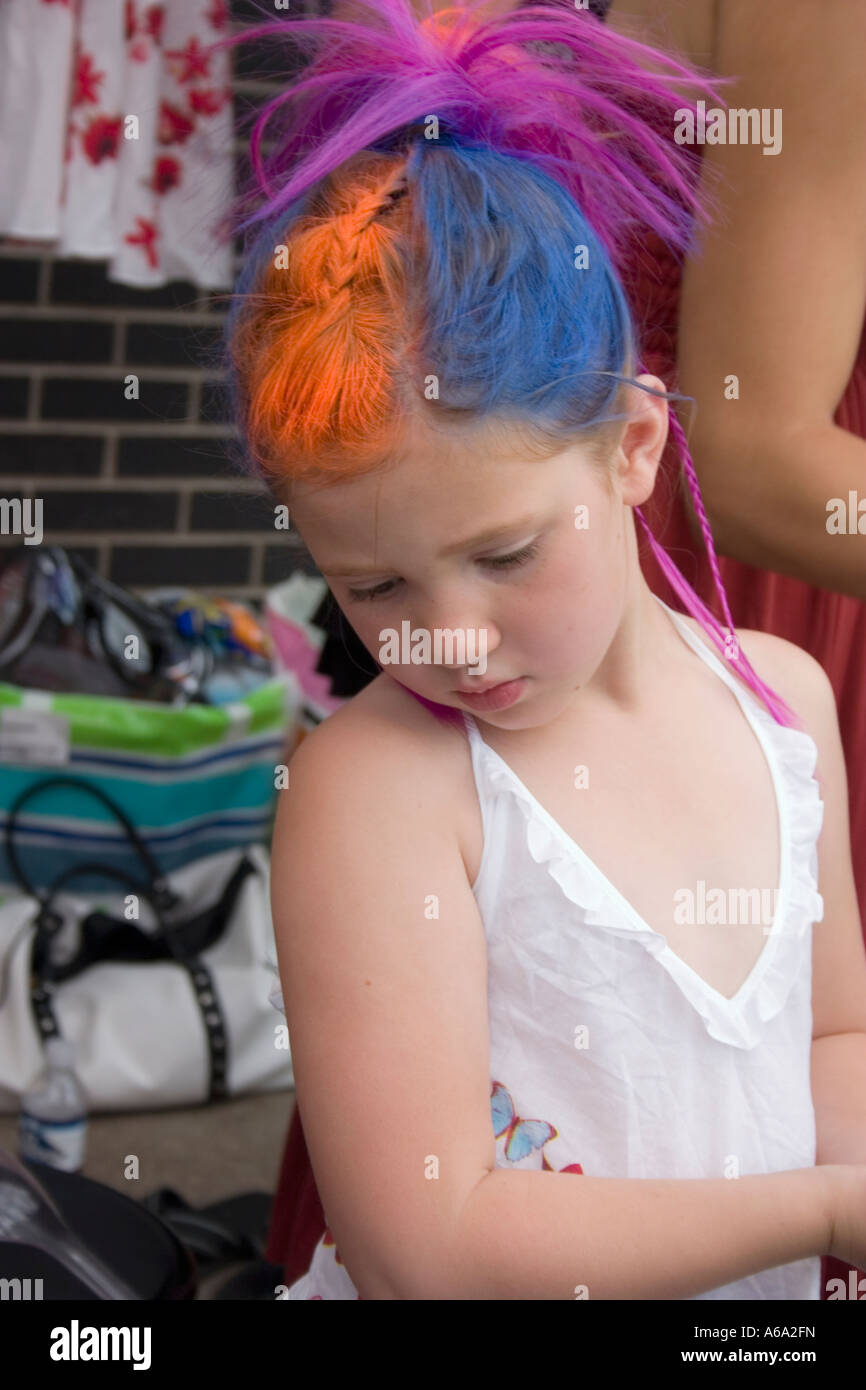 Girl with artistic hair sectioned in variegated colors. Grand Old Day Street Fair St Paul Minnesota USA Stock Photo