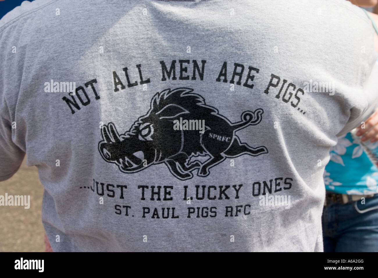 Not all men are pigs T shirt ... Just the lucky ones. Grand Old Day Street Fair St Paul Minnesota USA Stock Photo