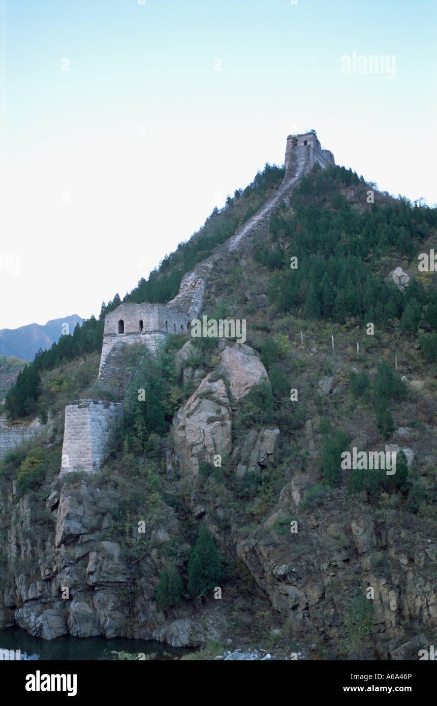 Crumbling Great Chinese Wall running down a hill, Huanghua Great Wall of  China, Great Wall