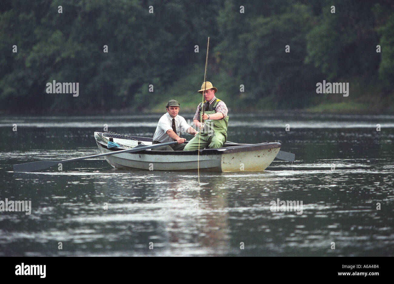 Salmon fishing on river Tweed with Ghillie Stock Photo Alamy