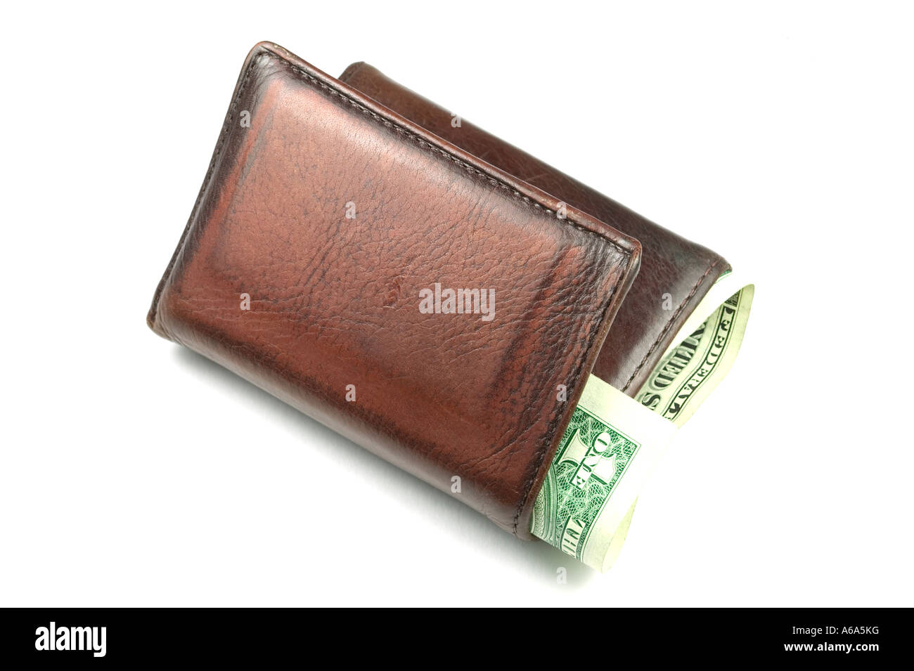 Old brown leather wallet with a dollar bill sticking out isolated on white Stock Photo