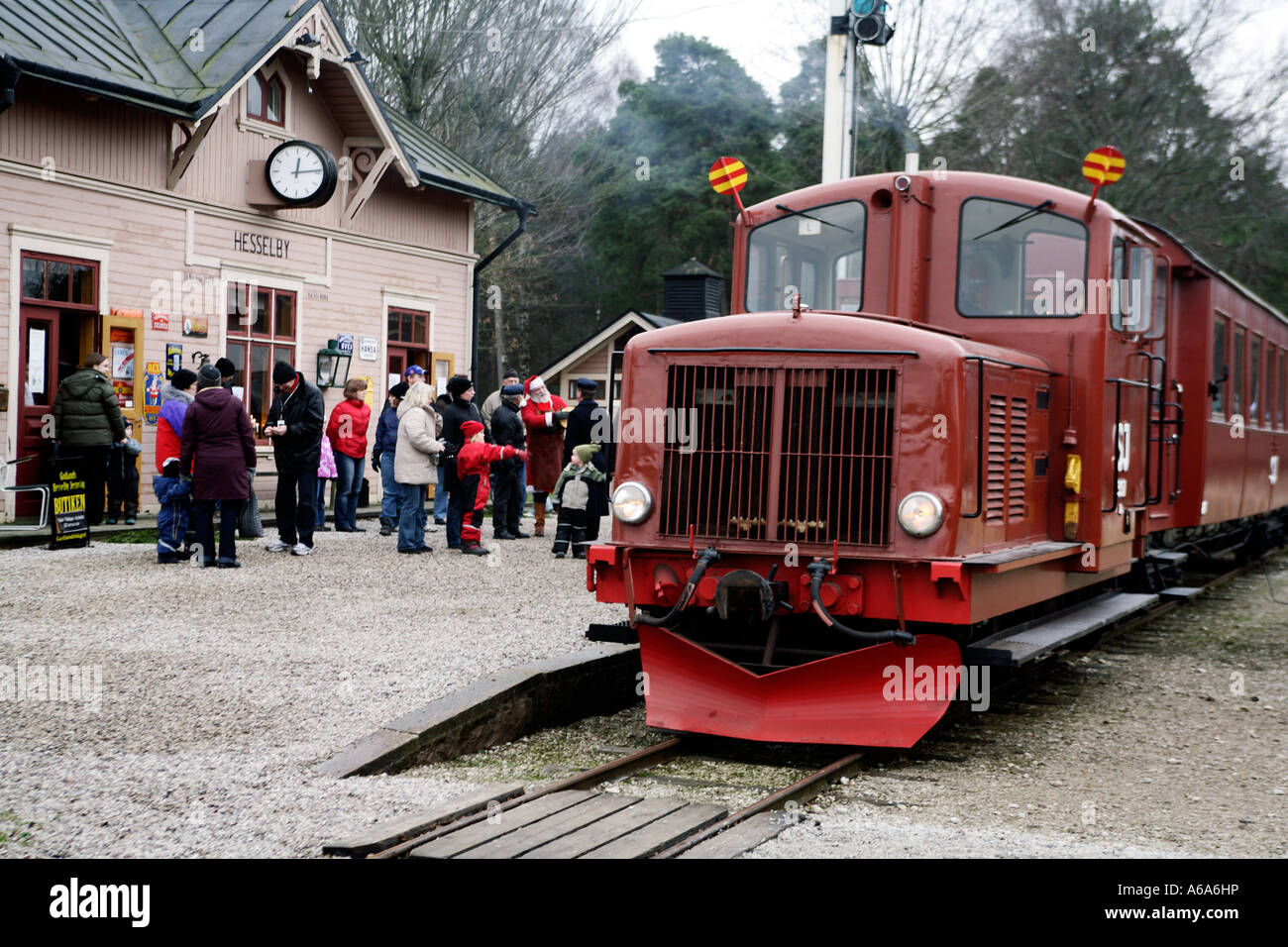 Holiday passengers waiting to board Vintage train with 1956 diesel locomotive at Dalhem railway station and museum Gotland . Stock Photo