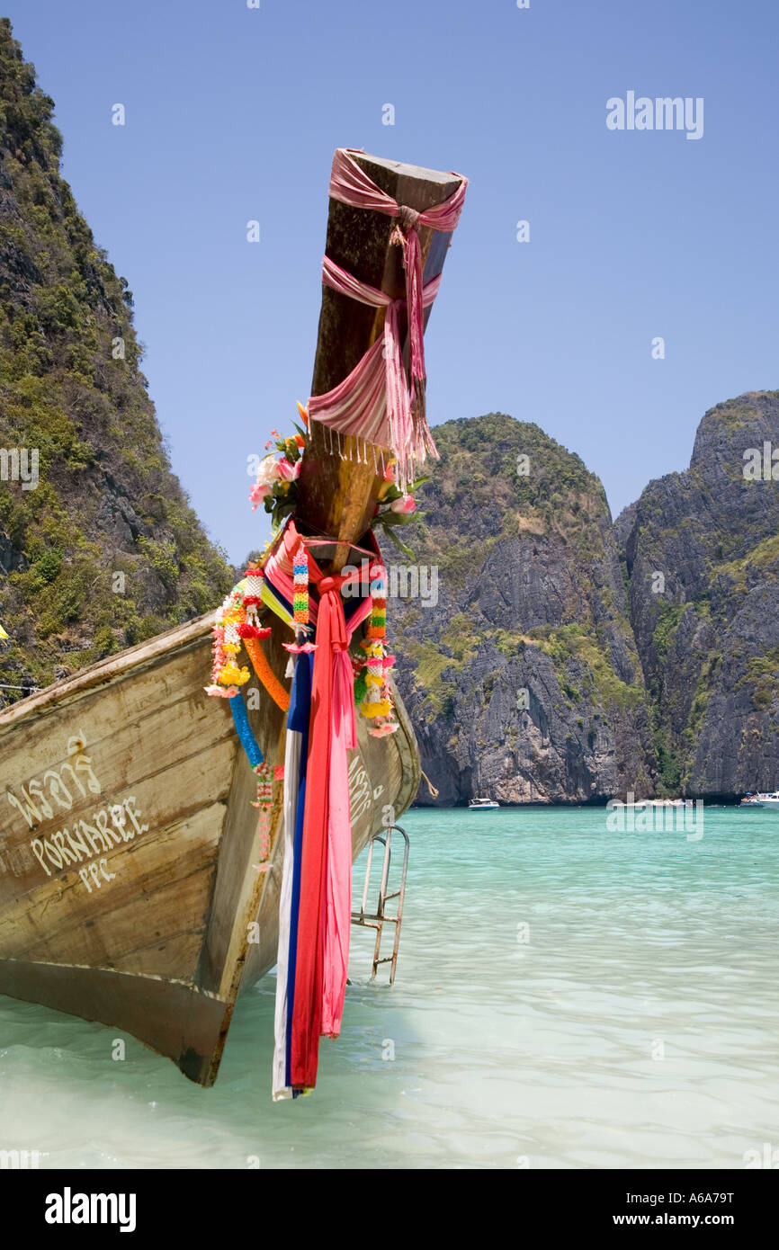 Prows of Asian wooden longtail boats;  long tailed boat prow with Buddhist garlands, Ko Phi-Phi Don island, Maya Bay,  Krabi Province, Thailand, Asia Stock Photo