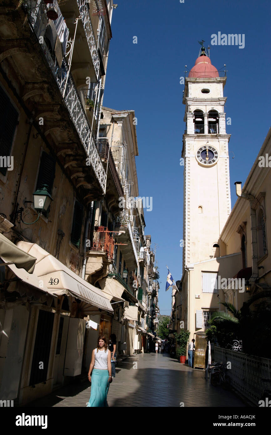 GREECE IONIAN CORFU TOWN TOURISTS ON THE STREET WITH SAINT SPIRIDON CHURCH Stock Photo
