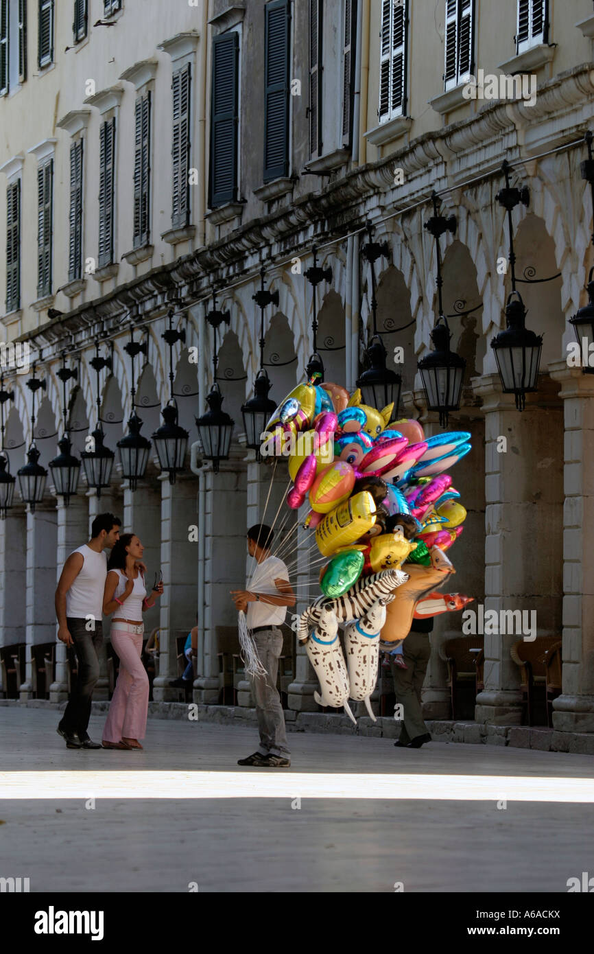 GREECE IONIAN CORFU TOWN A MAN SELLING BALLOONS ON THE LISTON Stock Photo