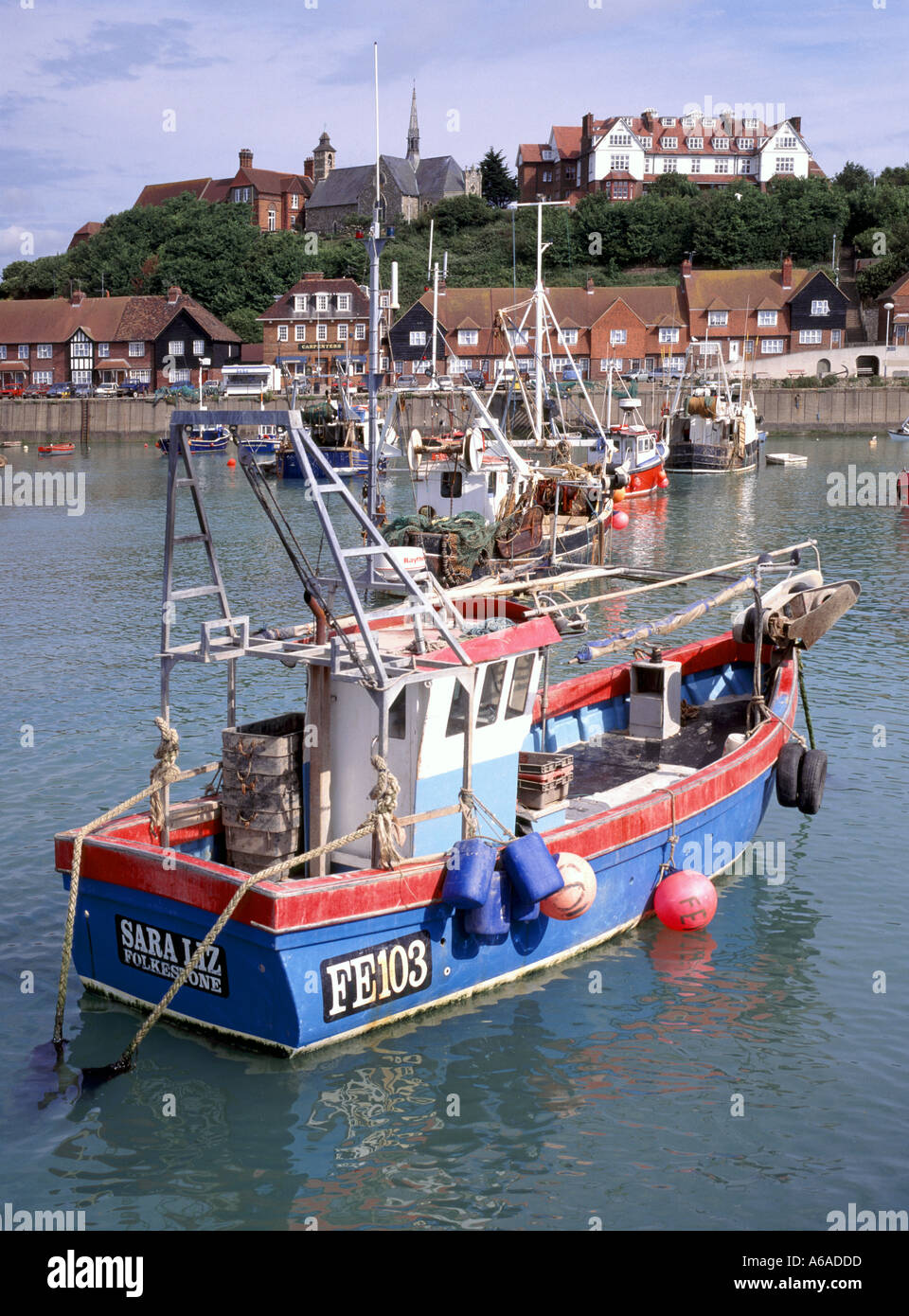 Folkestone harbour and fishing boats at high tide Kent England UK Stock