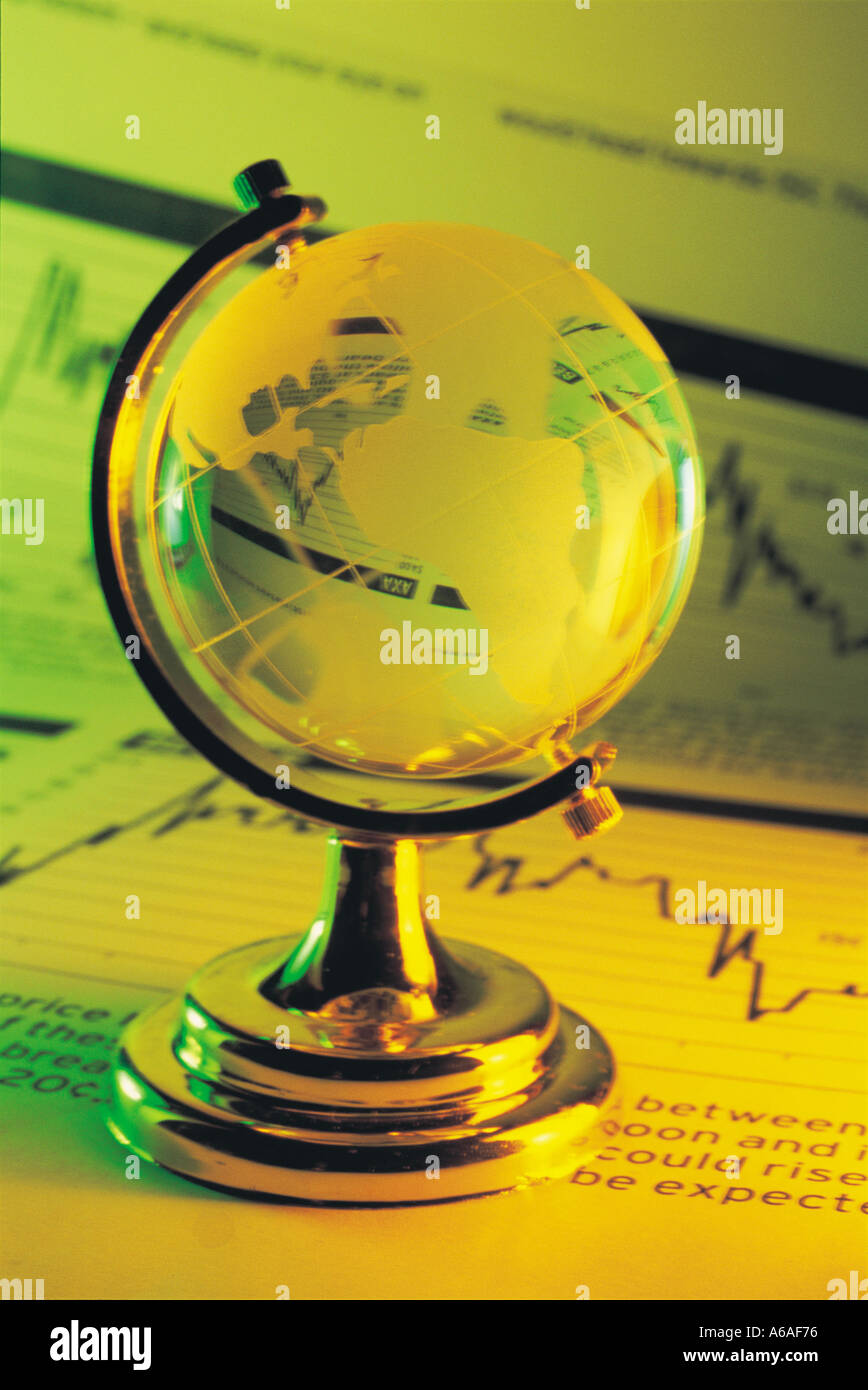 Desk Globe on Financial Newspaper Stock Photo