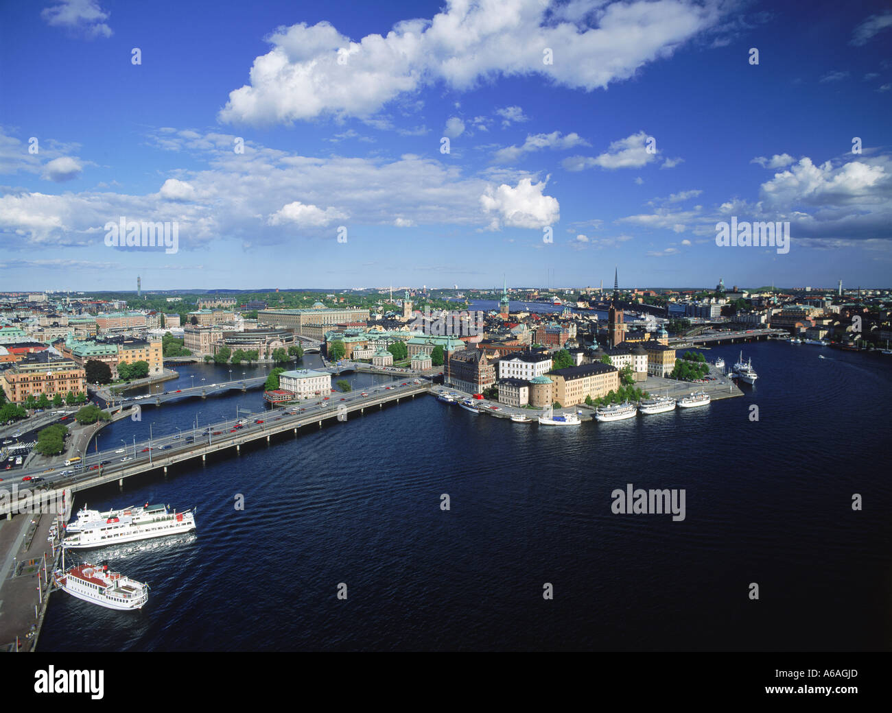 Overview of Stockholm in summer from City Hall with Riddarholmen Island and ferryboats on Riddarfjarden waters Stock Photo