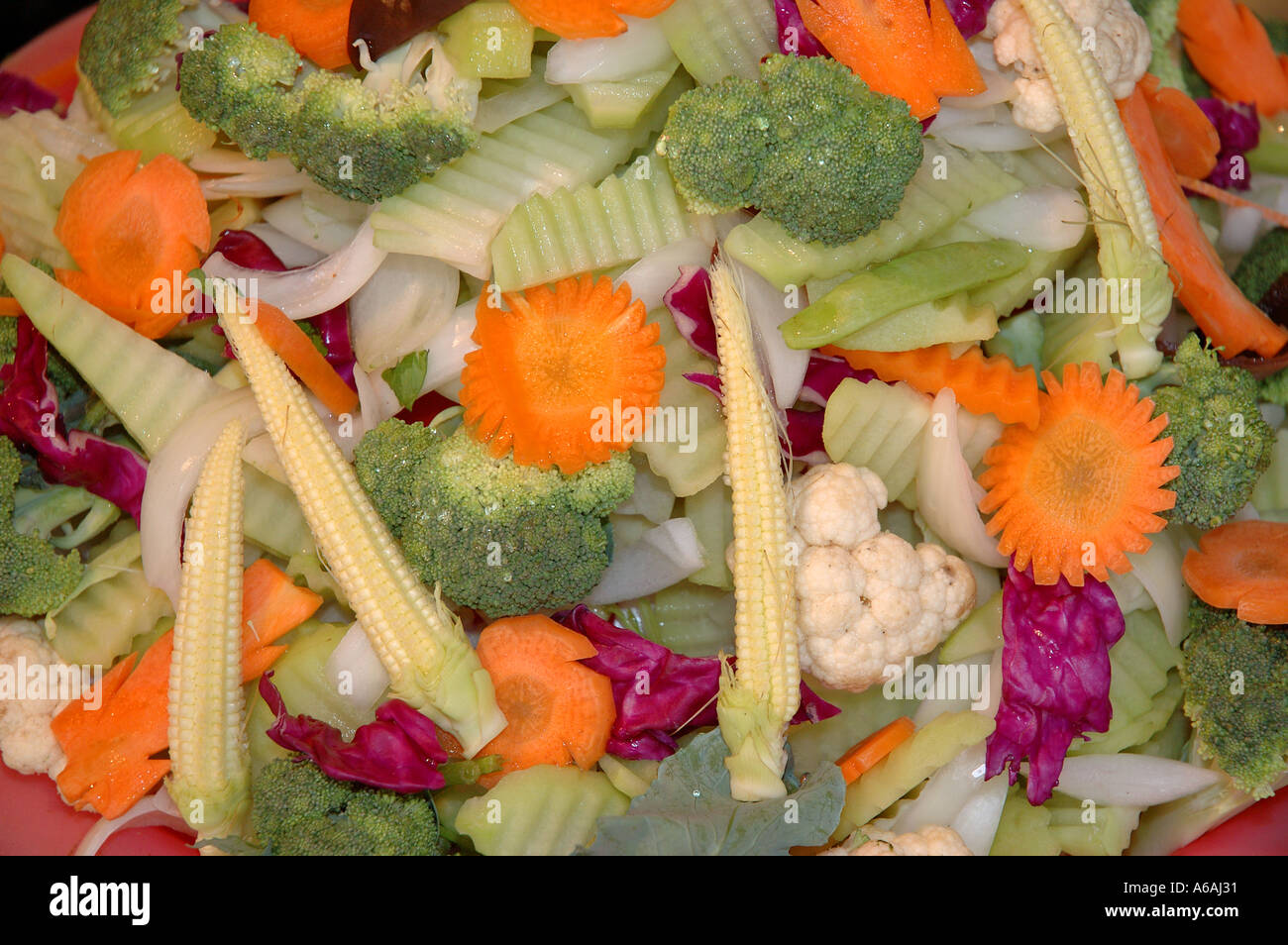 Hanoi Old Quarter capital city Vietnam South East Asia market selling cut fresh mixed stirfry salad vegetables Stock Photo