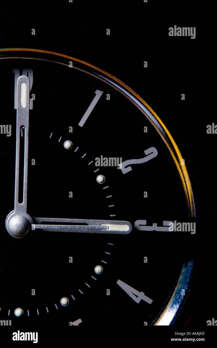Alarm clock set at three o clock Stock Photo - Alamy