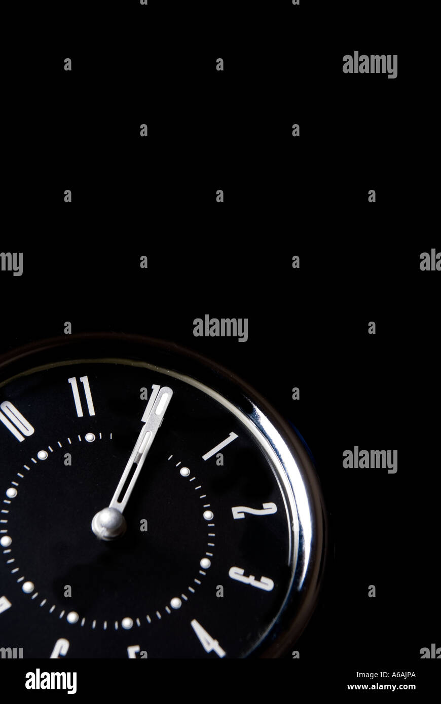 Alarm clock set at twelve o clock Stock Photo - Alamy