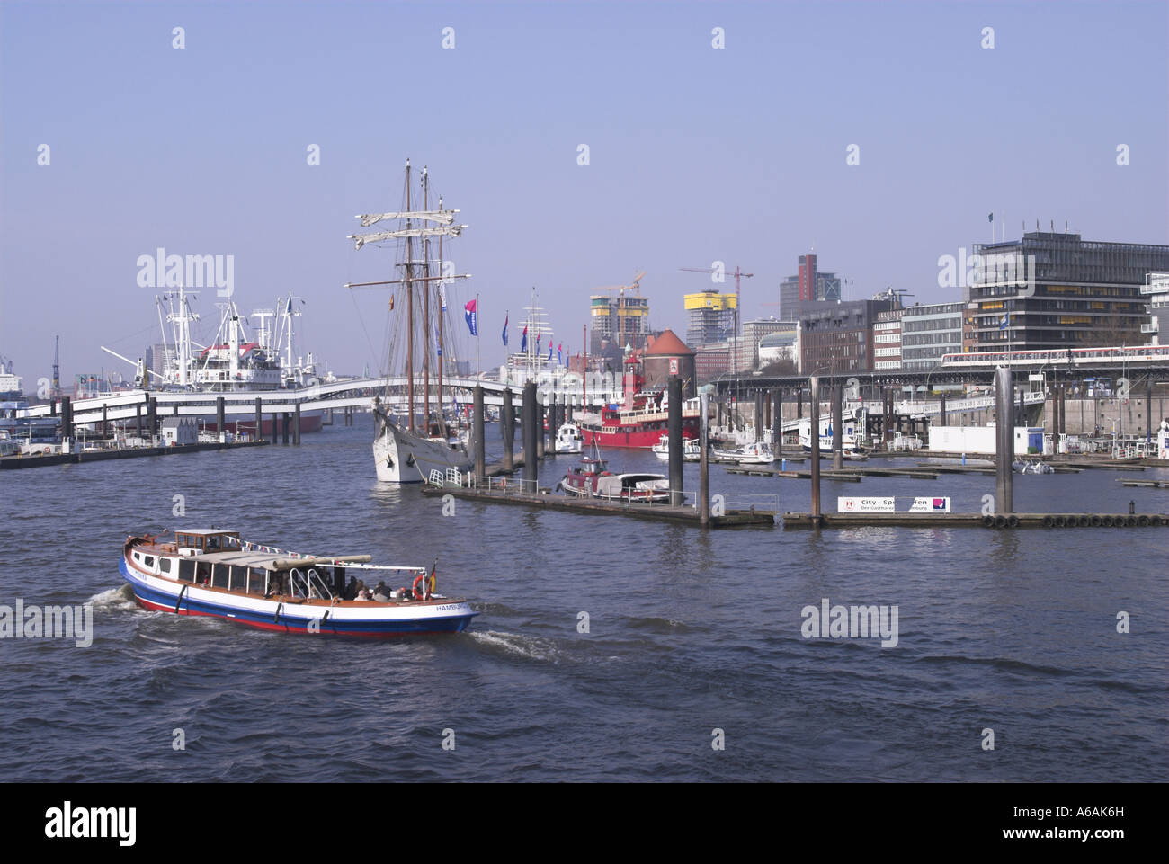 Harbour Hamburg Germany with tours pleasure boat in foreground Stock Photo