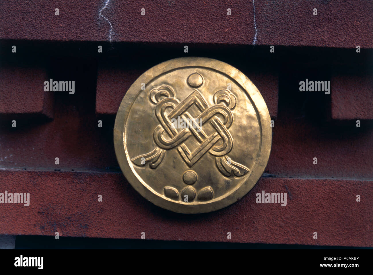 China, Tibet, Eight Auspicious Symbols, medallion embossed with Endless Knot, Stock Photo